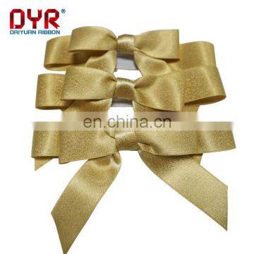 Shiny gold gift package bows