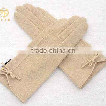 ladies wrist length wearing white wool glove