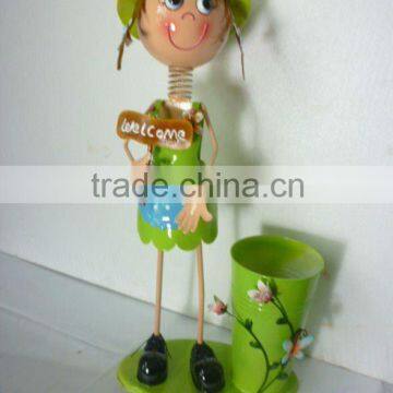 Decorative metal doll with flower pot as children gift