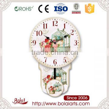 Flowers and blue-green small cage with round pendulum canvas large decorative clock