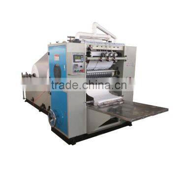 Box drawing facial tissue converting machine