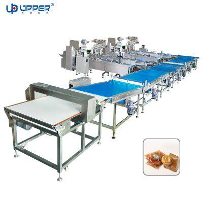 Rising and sinking automatic feeding and packaging line for cookies