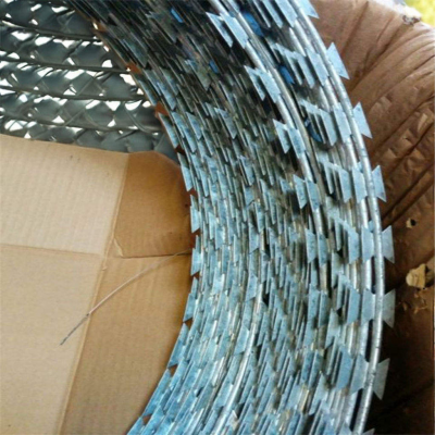 Green Razor-sharp Spiral Barbed Wire, Stainless Steel Coil, for Security Applications.