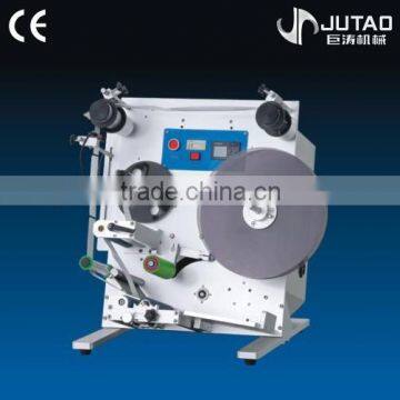Semi-automatic labeling machine for bottles