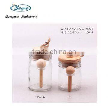 glass spice jar with wooden lid and spoon