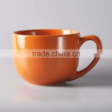 Colorful glazed ceramic soup bowl with handle