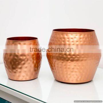 copper coloured drum shaped metal planters