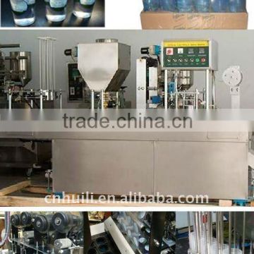 Automatic cup filling and sealing machine