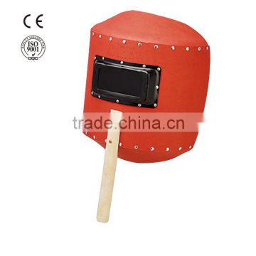 wood hand hold red steel paper helmet welding