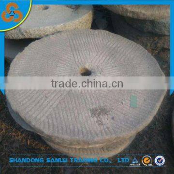 old millstone table grinding stone with wheel