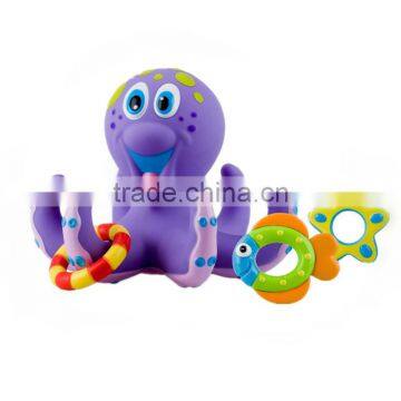 mini plastic purple Octopus and three Hula Hoops for baby bath time fun