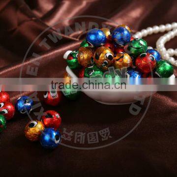 Colorful smiley face foil wrapped chocolate ball