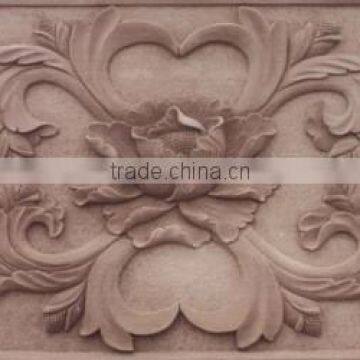 Stone flower wall relief sculpture