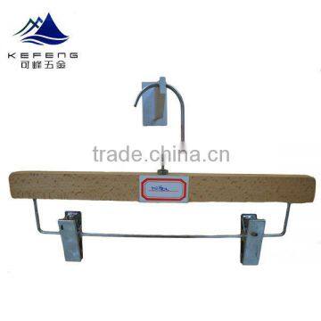 Wooden pants hanger with metal clamp