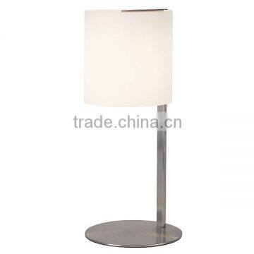 11.21-20 a polished steel base and frame with an an-off white cylindrical frosted glass shade Table Lamp