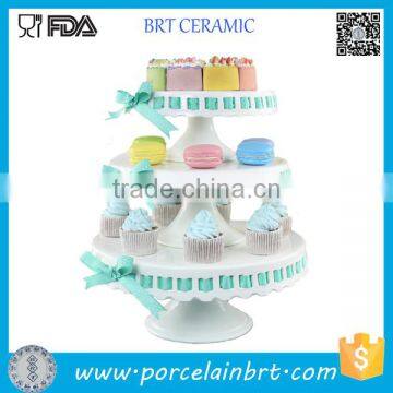 Wedding 3 tier ceramic cake stand with ribbon decorating cake