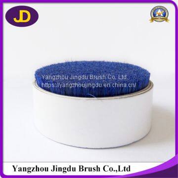 The manufacturer recommends the blue hard and short cutting natural bristle.