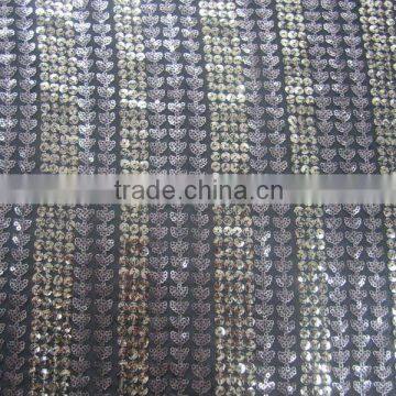 patterned sequins of 5mm and 3mm silver on mesh embroidery