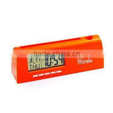 Digital clock with pencil inserted