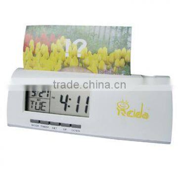 digital clock with pencil inserted