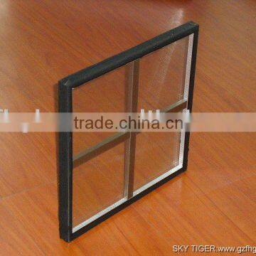 Clear vacuum insulated glass with aluminum cross