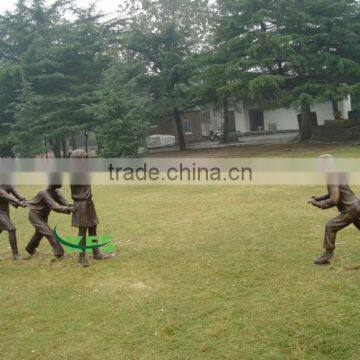 Bronze kids playing games sculpture