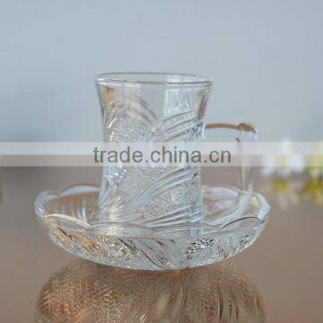 Elegant glass coffee cup and saucer