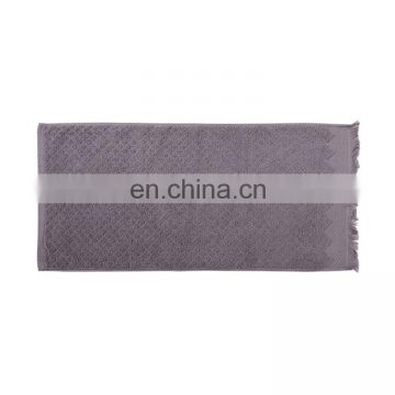 Soft 100% cotton rhombus pattern jacquard plain woven cheap face towel with tassels