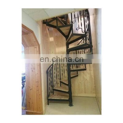 small space spiral staircase with decorative iron balusters design