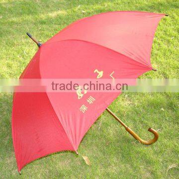 red wooden shaft golf umbrella