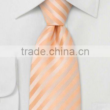 peach colored poly neckties with diagonal stripes