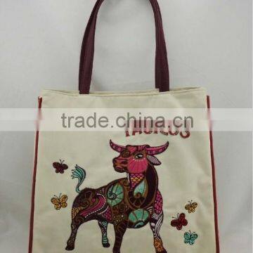 Applique embroidered canvas taurus tote bag