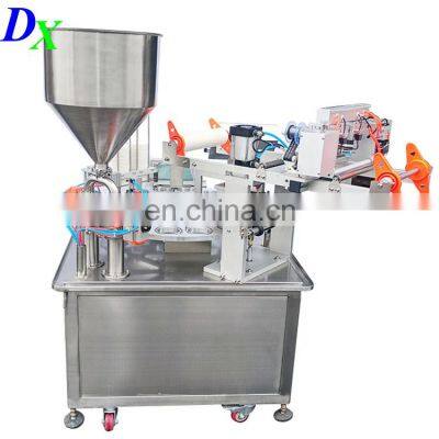Automatic Mul-tifunction Oil Milk Yogurt Jam Jelly Servo Rotary k Cup Filling Sealing Machine