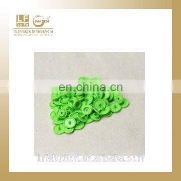 various colored plastic snap studs for baby clothes