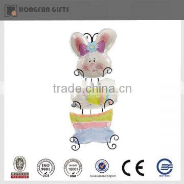 Colorful ceramic Easter straw rabbit shelf