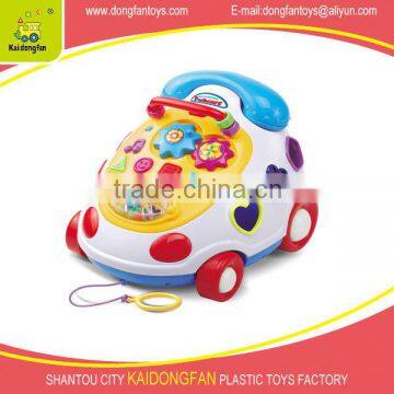 Educational mobile telephone vehicle with music and blocks