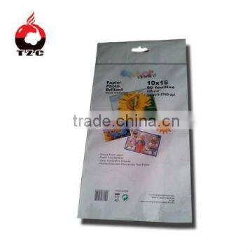 Resealable plastic bag with adhesive sticker