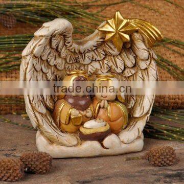 Resin nativity set in wing embrace