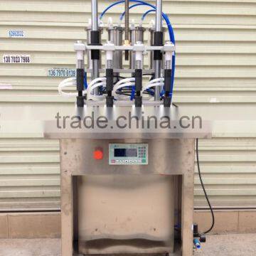 Semi-automatic four heads perfume filling machine