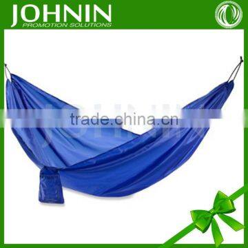 two people heavy family vocation camping plain outdoor hammock