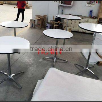 Round white high gloss dinner table