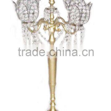 Gold candelabra with crystal flower