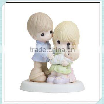 Ceramic bisque porcelain parents with baby figurine