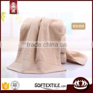 100% cotton beige color with satin border bath towel