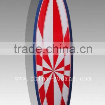 Red hypnotic design fiberglass retro surfboard