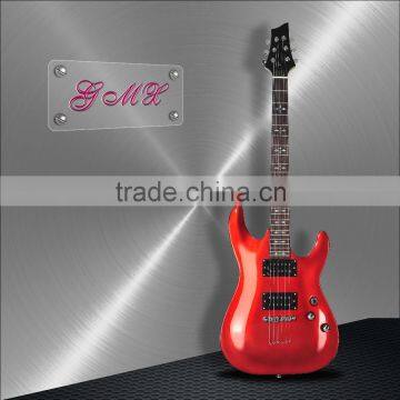 Red electric guitar with big bridge hollow body