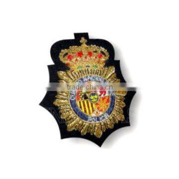 Spanish policia cap bullion wire badges