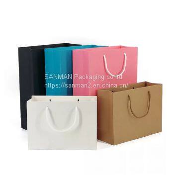 Die cut handle paper carton bag