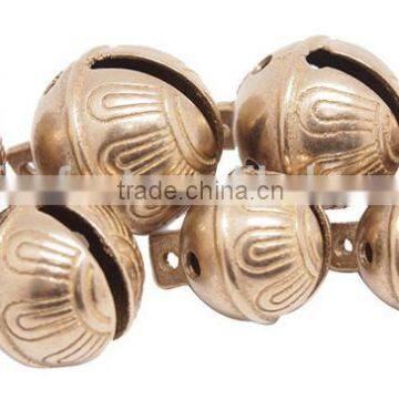 Sleigh Bell With Leather Strap Handing on the Door for Christmas Decoration