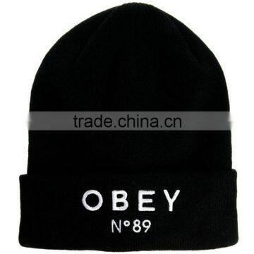 100% polyester black hat beanie with logo embroidery on the rolled cuff